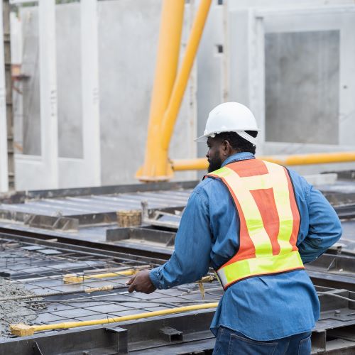 Man casting concrete